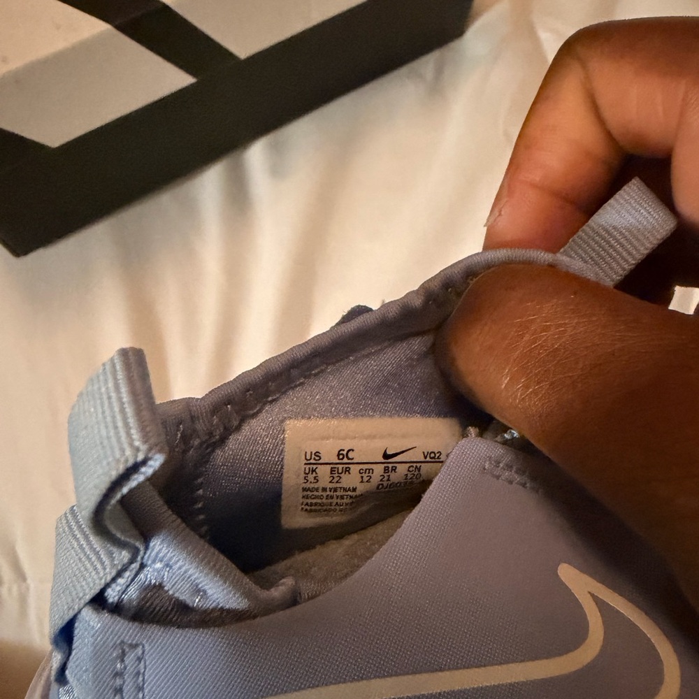 Nike Light Blue Slip-On Sneakers with White Swoosh